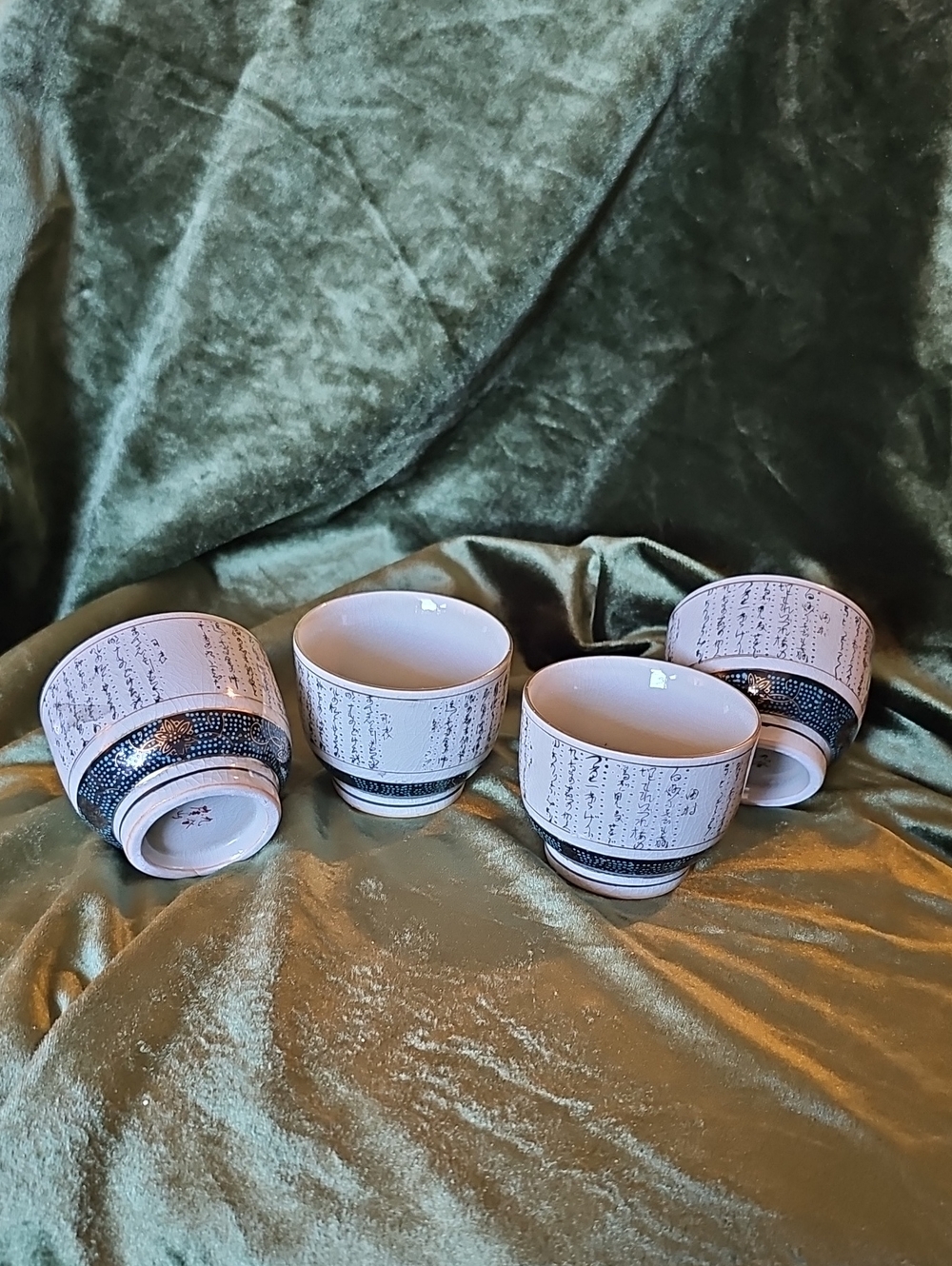 Vintage Japanese Kutani ceramic tea or sake cups.